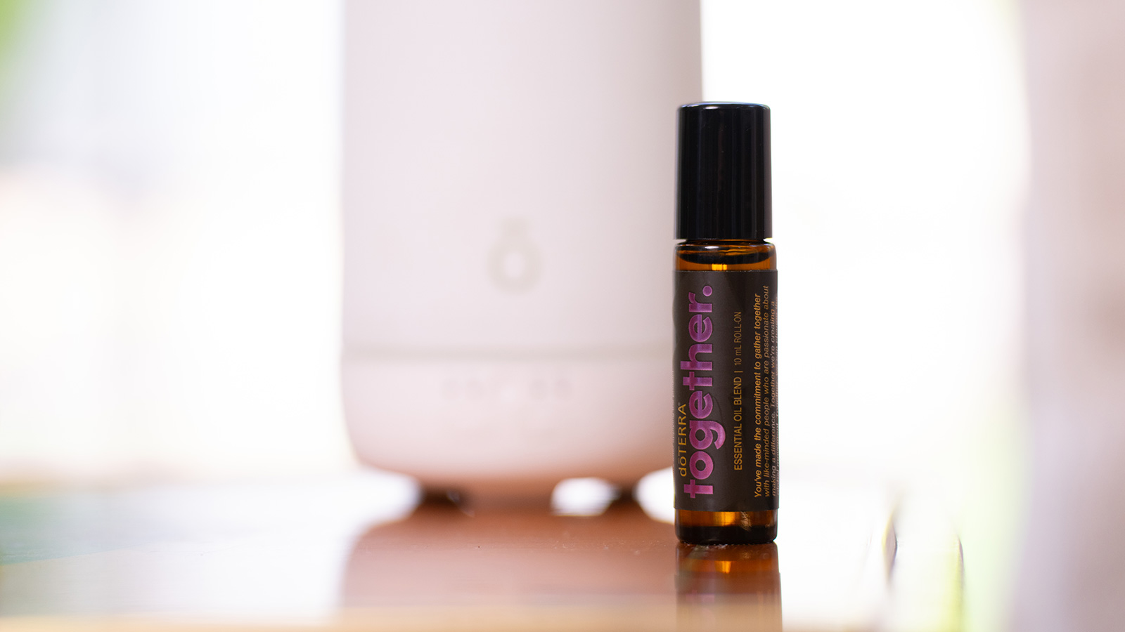 A bottle of Together in front of a diffuser