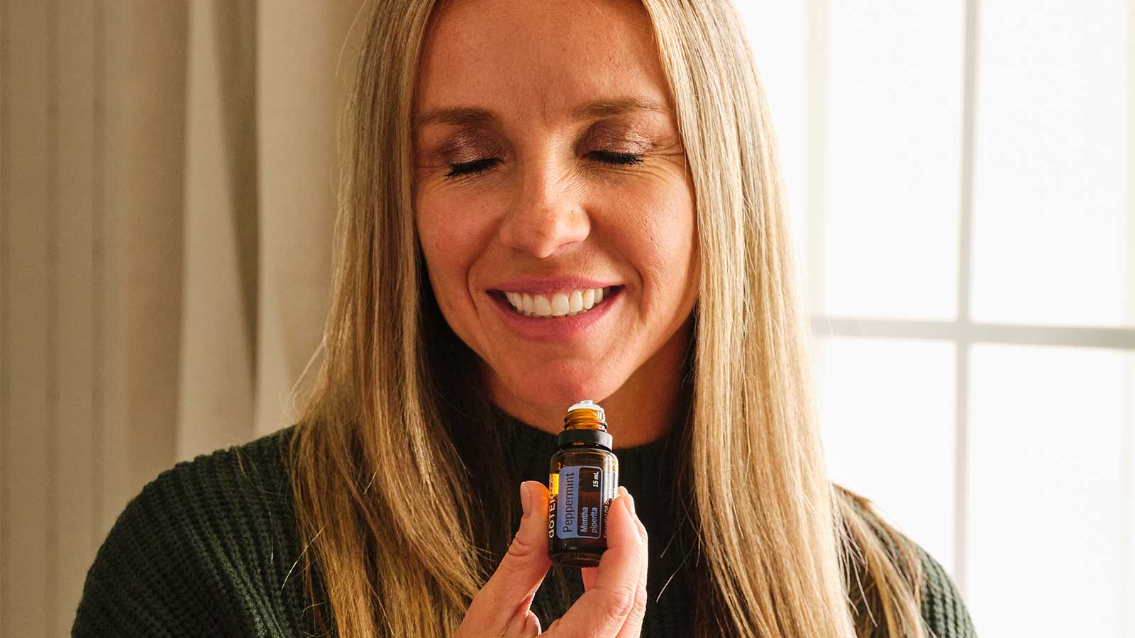 Woman smelling peppermint