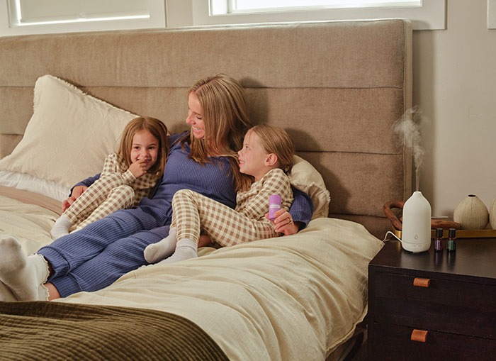Mother in bed with two daughters