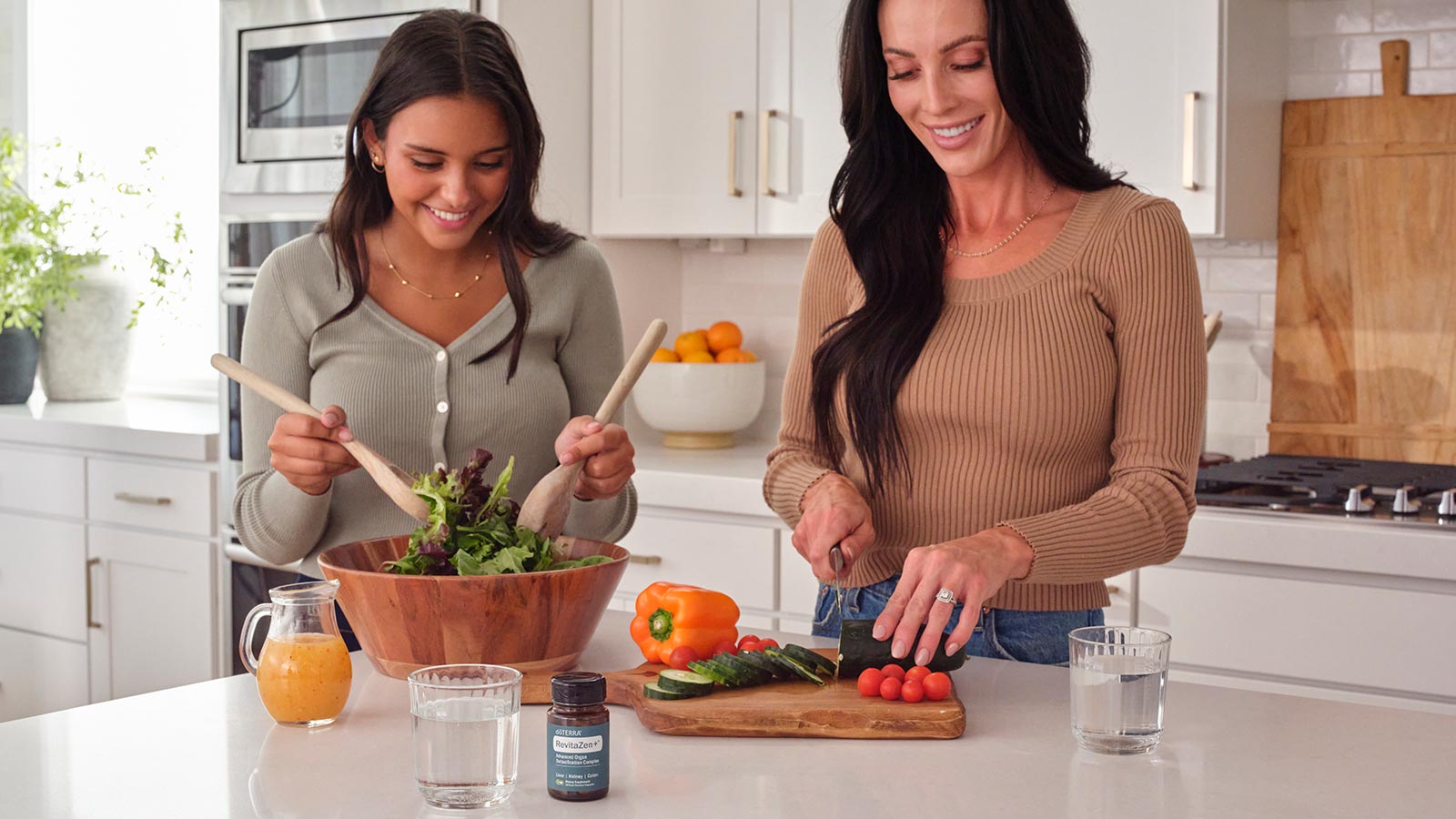 Two women preparing food with RevitaZen+ on the table