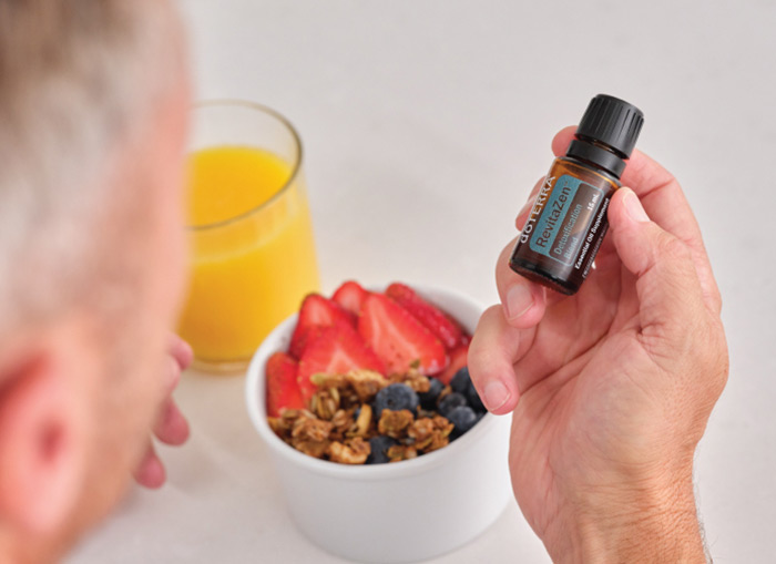 A person holding doTERRA RevitaZen