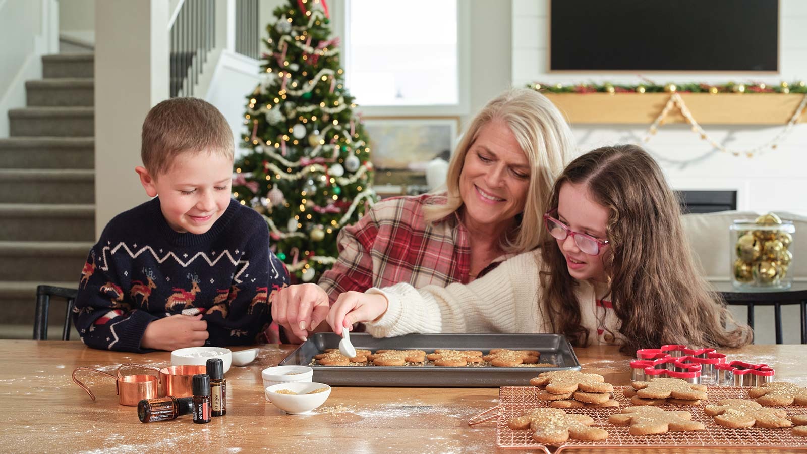 Grandmother making gingerbread men with grandchildren