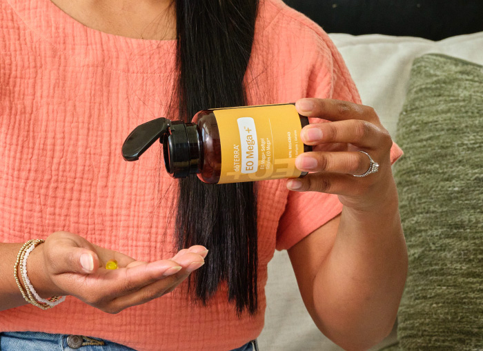 woman with doterra bottle.