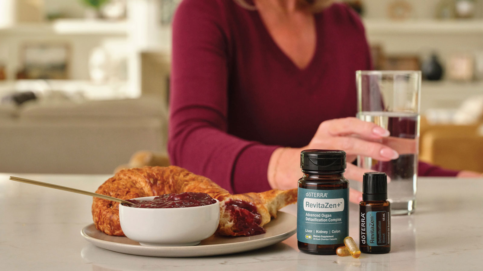 A woman standing behind a breakfast with RevitaZen products