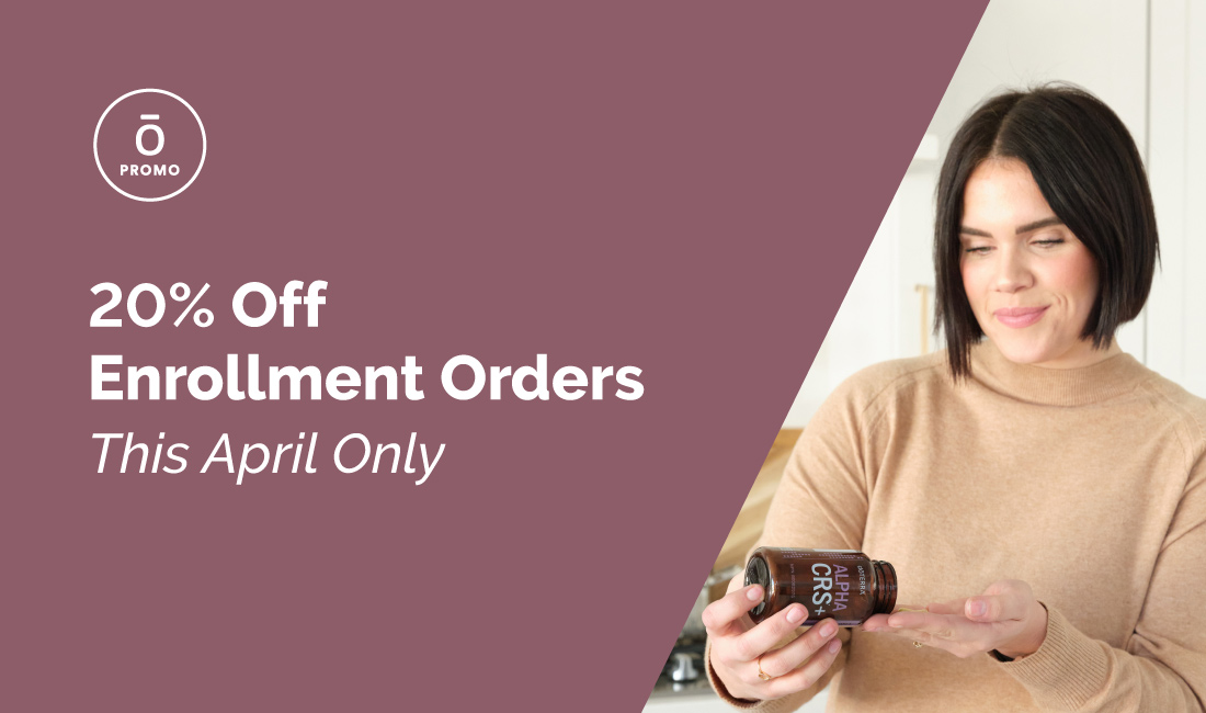 Woman with bottle of doTERRA product.