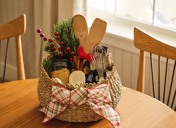 Basket containing essential oils and baking instruments 