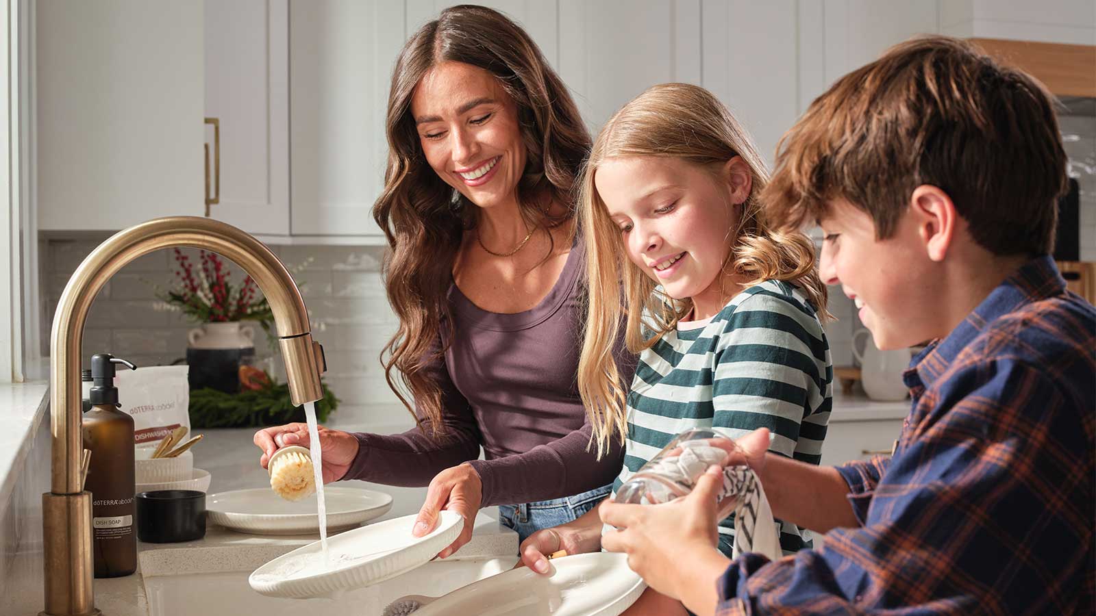 Mother and children washing dishes