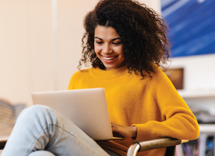 Lady looking at her laptop