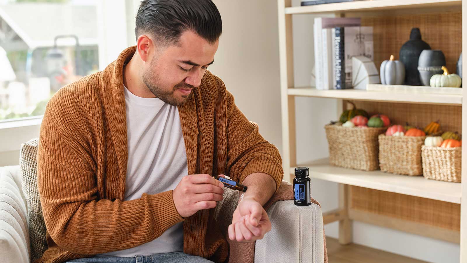 Man applying doTerra Adaptiv touch to arm