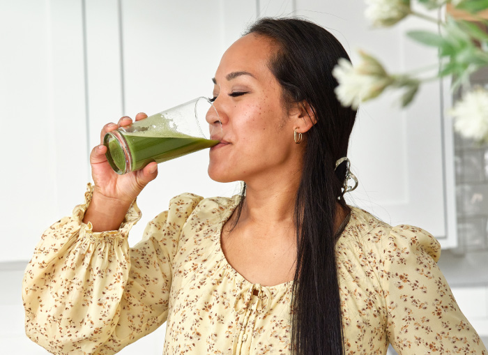 Woman drinking a glass of VMG