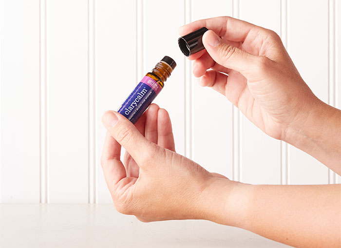 Hand holding ClaryClam oil