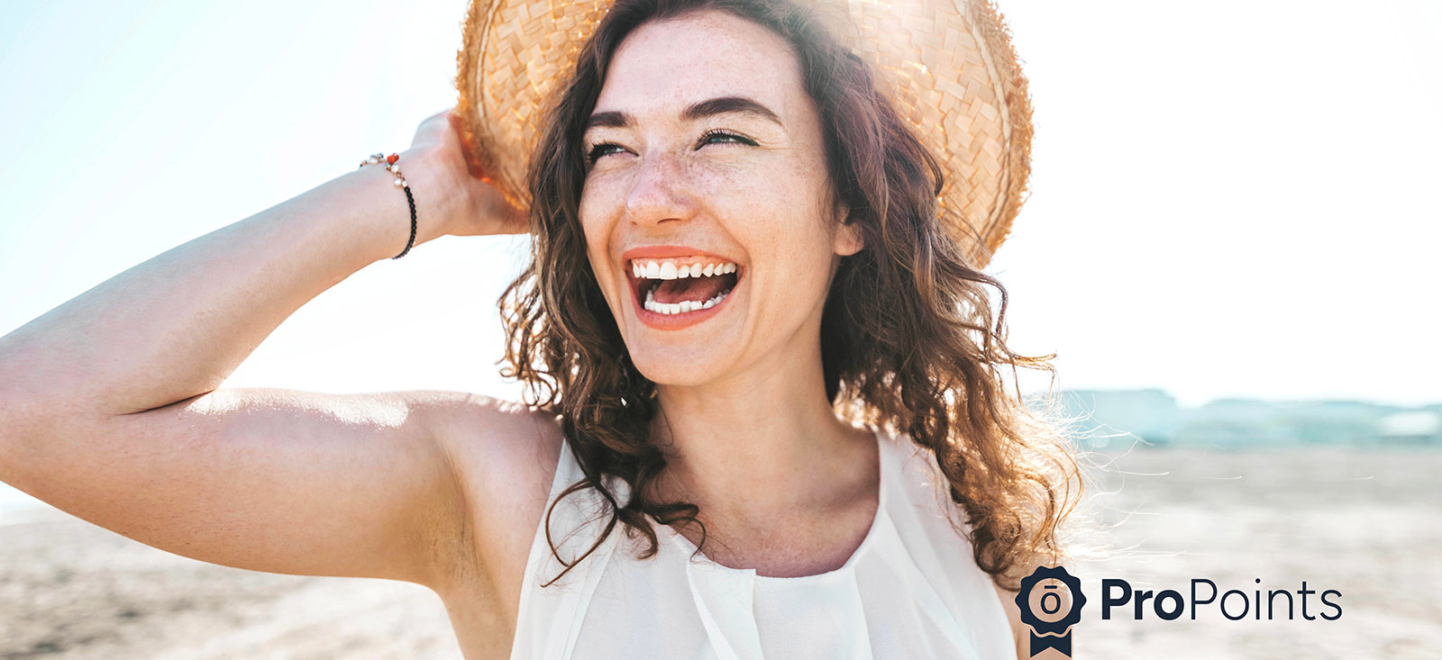 Woman at beach with sun hat