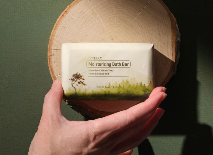 Hand holding moisturizing bath bar
