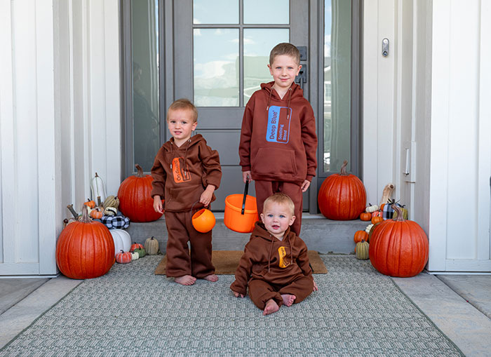 Three boys dressed up as doTERRA essential oils for Halloween