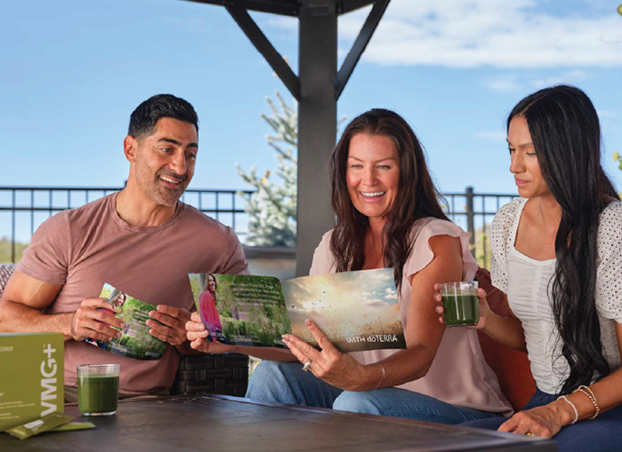 People reading a doTERRA Magazine 