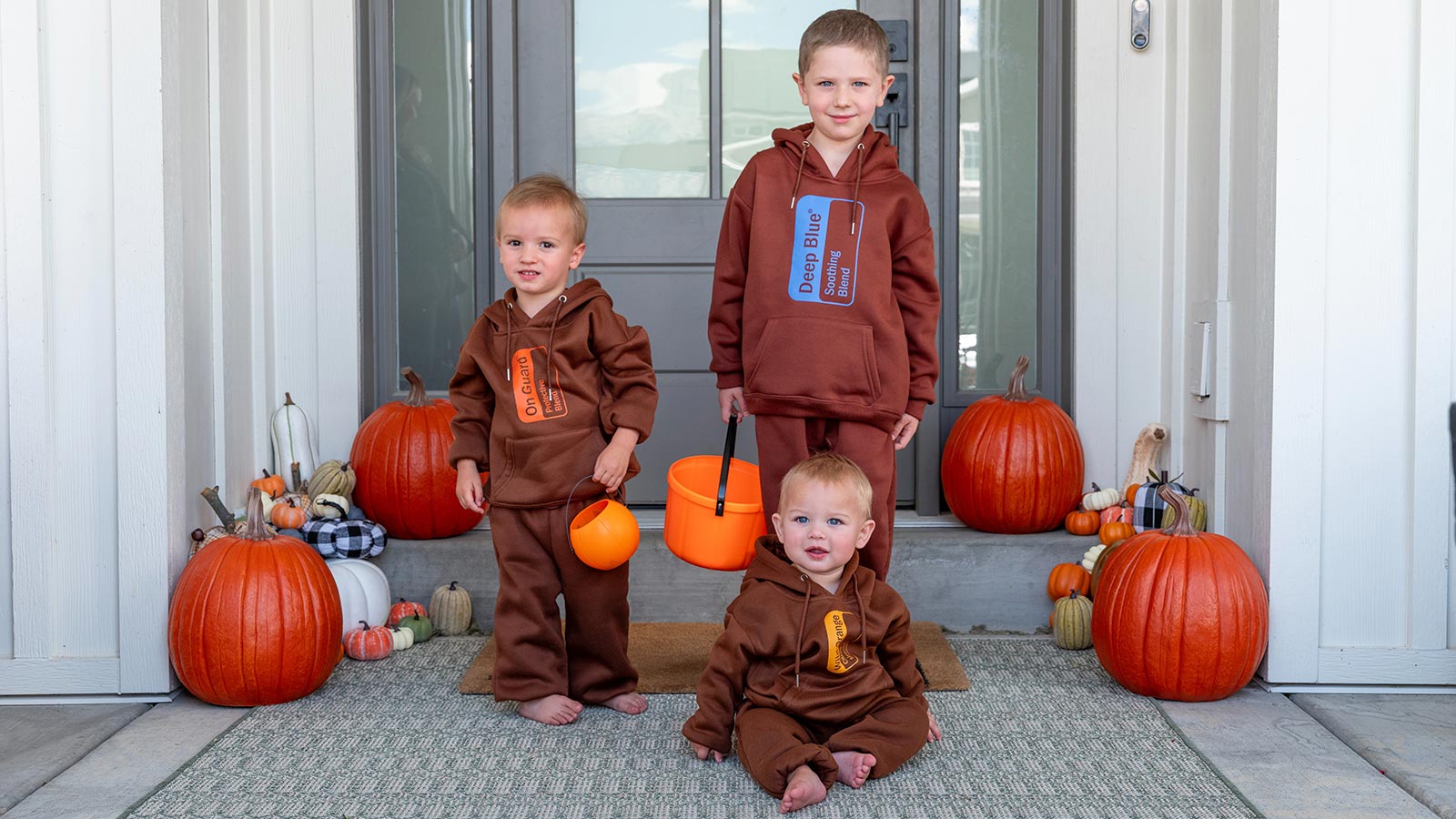 Three boys dressed up as doTERRA essential oils for Halloween
