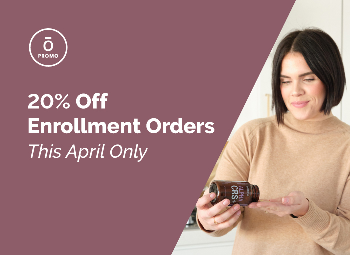 Woman with bottle of doTERRA product.