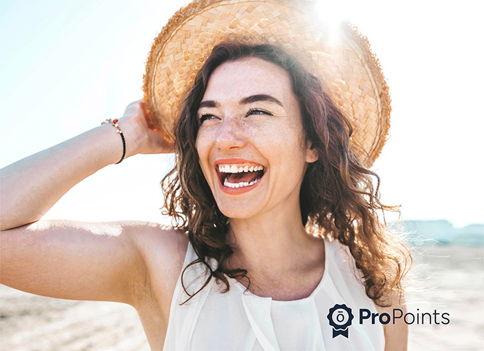 Woman at beach with sun hat