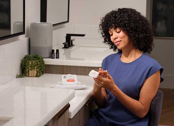 Woman using on guard hand wipes