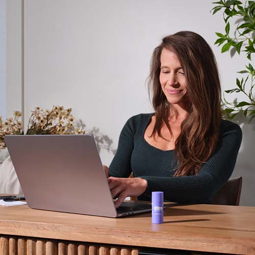 A woman sitting at her laptop