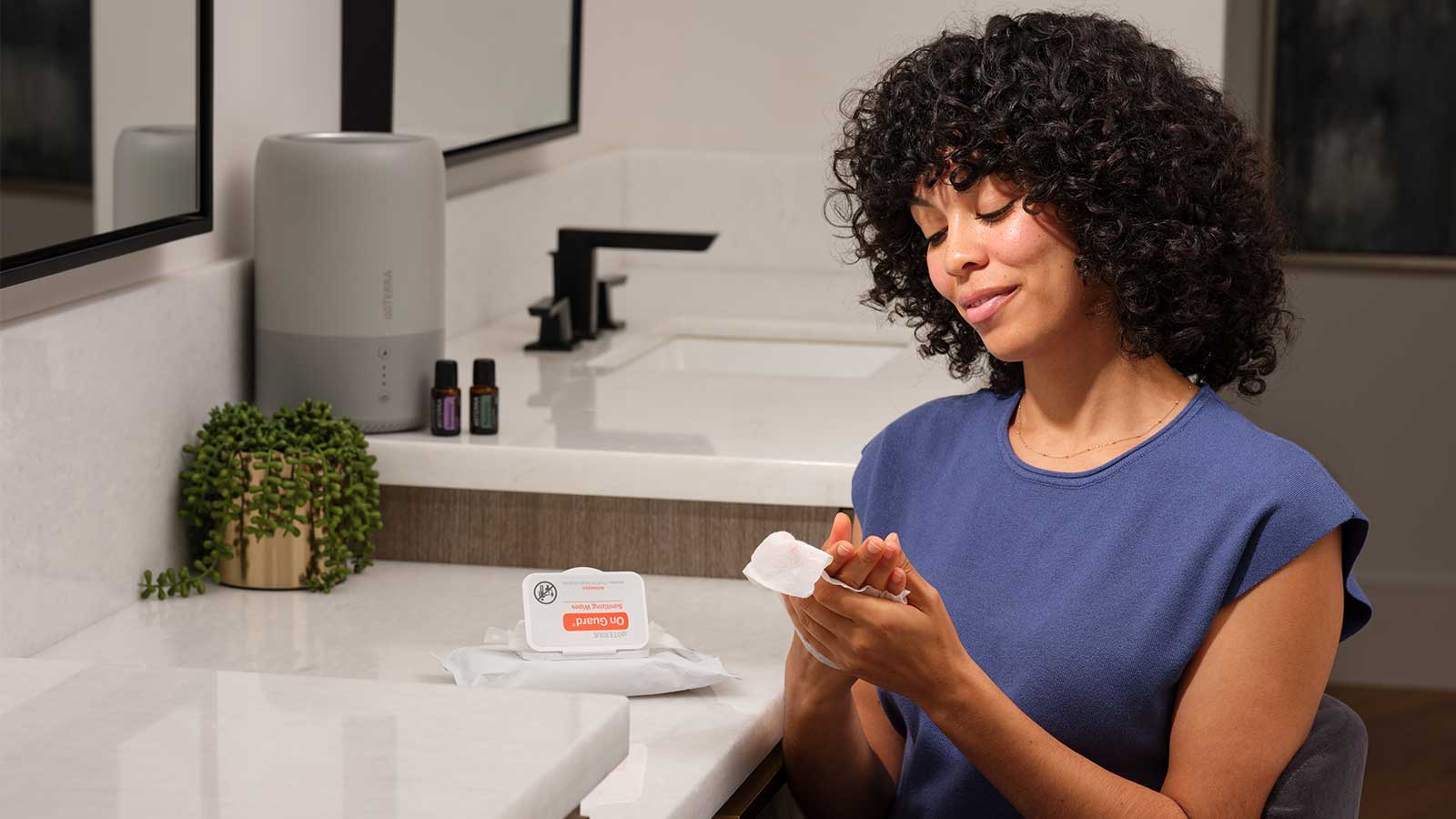 Woman using on guard hand wipes