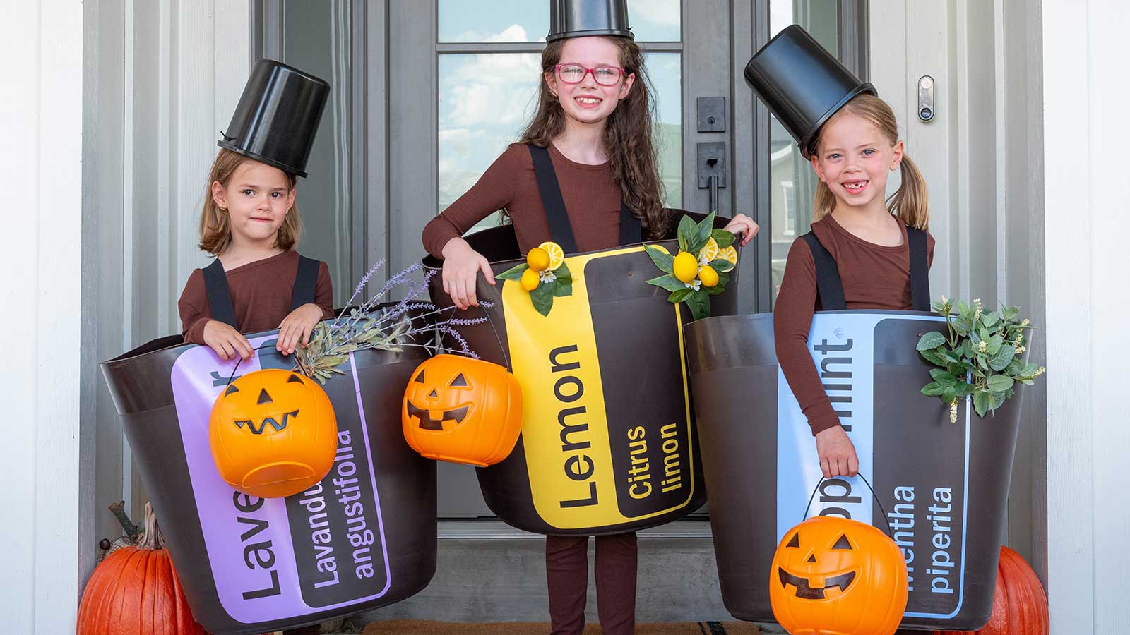 Three girls dressed up as doTERRA essential oils for Halloween