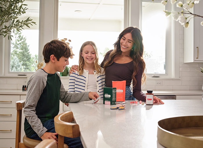 Smiling family trying doTerra OnGuard products